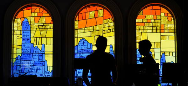 Arts Award boys stood in stained-glass window 