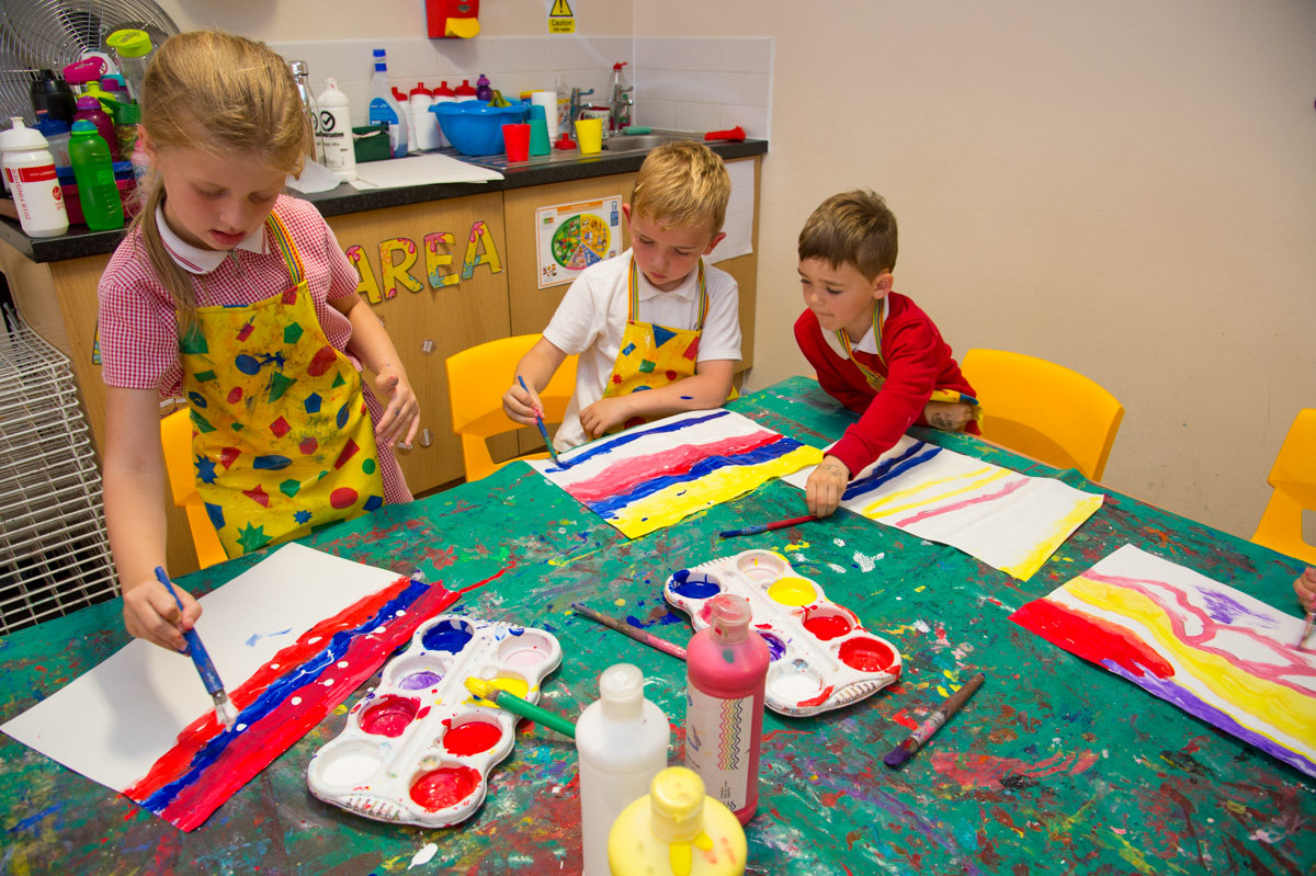 Children painting in a classroom